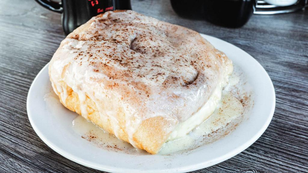 Large Fresh Baked Cinnamon Roll · Heating Instructions - Place cinnamon roll on a microwave safe plate, pour icing on top of cinnamon roll, heat for 1 min.  Top with butter and enjoy!