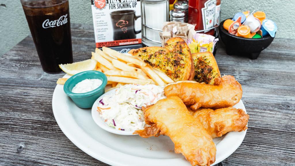 Fresh Battered Fish & Chips · Pacific cold water cod dipped in biscuits café fresh batter & deep fried golden brown. Served with fries, coleslaw, our own tartar sauce, garlic bread & fresh lemon.