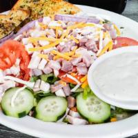 Chef Salad · Fresh salad greens, sliced turkey breast & ham, shredded cheddar cheese, topped with sliced ...