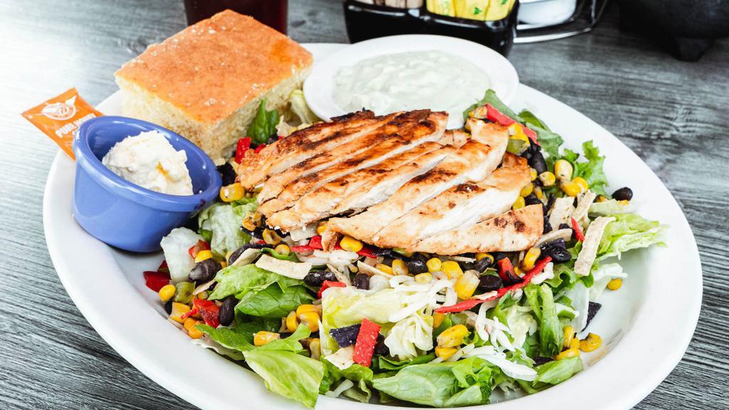 Fiesta Chicken Salad · Grilled chicken, black beans, corn, bell peppers, onions, tortilla strips & pepper jack cheese. Served with an avocado ranch dressing on the side.