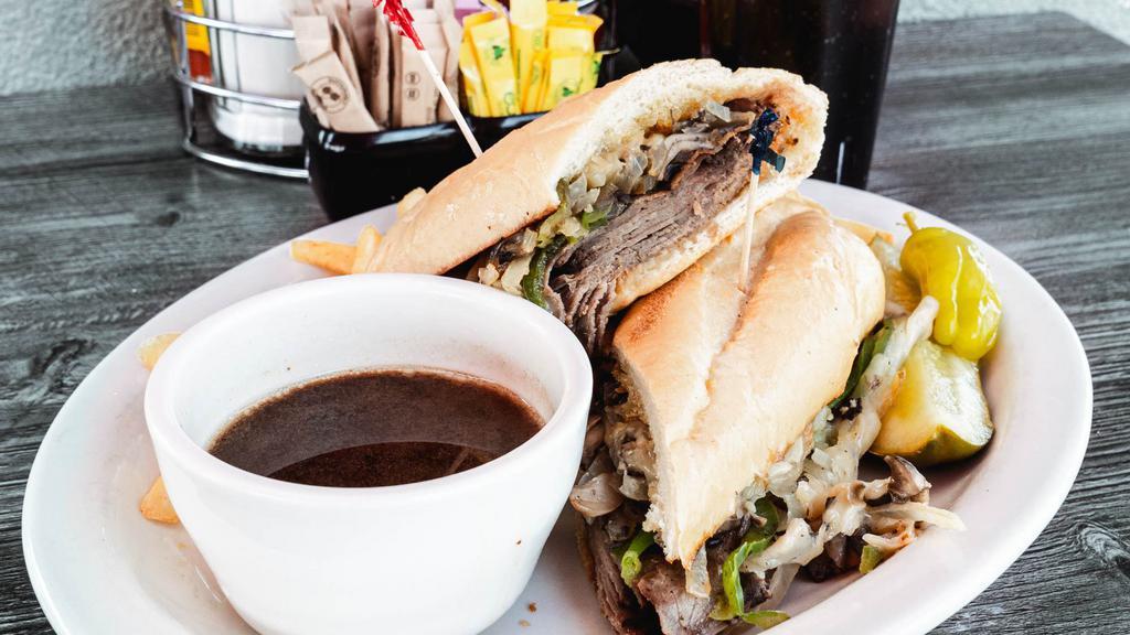 French Dip · Roast beef thinly sliced & piled high on a fresh dip roll. Served with hot au jus.