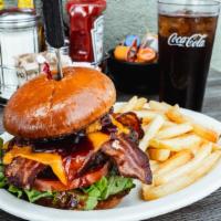 Bbq Western Bacon Burger · Cheddar cheese, bacon, lettuce, tomato & mayonnaise. Topped with our bold BBQ sauce & onion ...