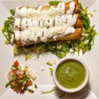 Chicken Taquitos · Shredded chicken rolled in corn tortillas, deep fried, served with spicy avocado dip and a t...