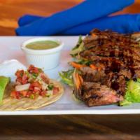 Carne Asada (Steak) Salad · Spring mix with romaine, carrots, sweet corn, sliced avocado served with a side of spicy avo...