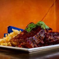 Bbq Baby Back Ribs Full Rack · Slowly cooked to perfection, bathed in BBQ sauce topped with mango salsa served with crispy ...