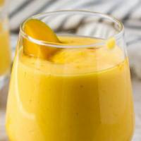 Mango Lassi · Refreshing yogurt drink served sweet with mango.