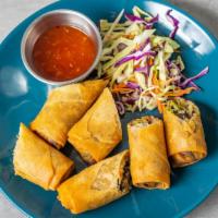 Spring Rolls · Fried homemade spring rolls mixed with vegetables, mushroom soy sauce, sugar and served with...