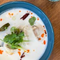 Tom Kha · Coconut milk sour soup with Thai chili paste, galangal, kaffir lime leaf, lemongrass, mushro...