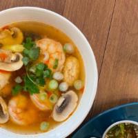 Tom Yum · Hot and sour soup flavored with Thai chili paste, galangal, kaffir lime leaf, lemongrass, mu...