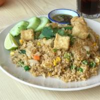 Fried Rice · Stir-fried jasmine rice, egg, peas, carrots, onion, green beans corn and house soy sauce.