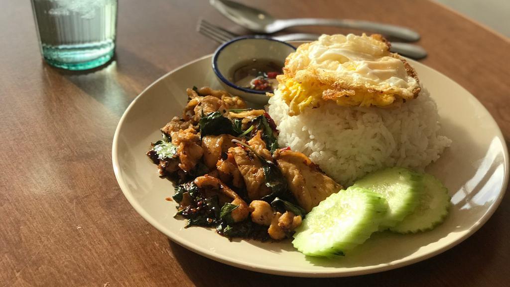 Old Fashion Pad Ka Pao · Thai basil stir-fried with house oyster sauce, served with Thai fried egg sunny side up topped on jasmine rice.