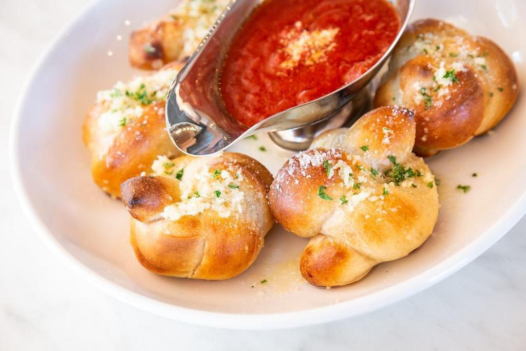 Garlic Knots · Homemade Dough Tossed In Olive Oil and Fresh Garlic, Sprinkled with Pecorino Romano.