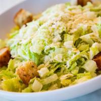 Caeser Salad · Hearts of romaine tossed with creamy caesar dressing, parmigiano-reggiano and homemade crout...