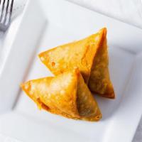 Vegetable Samosa (2 Pieces) · Crispy pastry with potatoes and peas, deep fried.