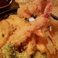 Shrimp Tempura · Shrimp and assorted vegetable lightly battered and fried. Served with dipping sauce.