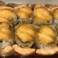 Grand Canyon Roll · Crab and avocado roll topped with salmon and yum yum sauce, baked with eel sauce on top.