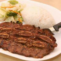 Teriyaki Beef Short Ribs · Beef short ribs marinated and served grilled. Served with steamed rice and stir-fried vegeta...