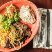 Plato De Carne Asada · Grilled steak served with a side of rice and beans, a chile toreado, guacamole and your choi...