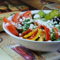 Greek Salad · Romaine lettuce, tomatoes, cucumbers, bell peppers, onions, Greek olives and feta cheese wit...