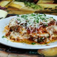 Beef Lasagna · Layers of pasta with béchamel, ground beef and spices, baked in our marinara, with mozzarell...
