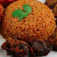 Jollof Rice · Perfectly seasoned rice blended with tomato and bell peppers puree served with lightly fried...