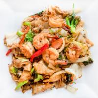 Pad Kee Mao · Spicy. Stir-fried fresh wide rice noodles with broccoli, onion, bell pepper, basil leave and...