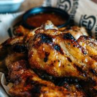 Smokin' Wings · Grilled or fried and smothered with your choice of Buffalo or BBQ.