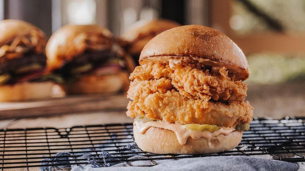 Fried Chicken Sandwich · Crispy chicken, pickles, toasted bun, and Twisted BBQ Ranch sauce.