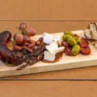 Brewer'S Board · Brie cheese, fig jam, andouille sausage, prosciutto, almonds, fresh fruit, tangerine & chile...