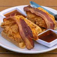 Chicken & Waffles · Crispy chicken, belgian waffles, spicy syrup, maple butter, bacon.