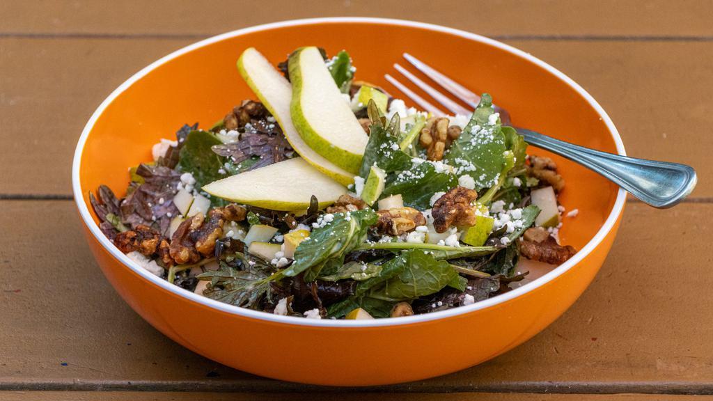 Kale & Pear · Baby kale, goat cheese, diced pear, candied walnuts, citrus vinaigrette.