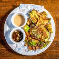Brussels Sprouts Hot Salad · Vegan. Deep-fried brussels sprouts, sesame seeds, black pepper, chili and sesame and vinegar...