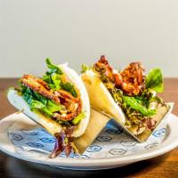 Pork Buns · Rakkan Recommended. Steamed buns filled with slow-braised pork, sesame seeds, baby mix green...