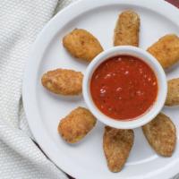 Jalapeno Poppers · 8 pieces with delicious Kebella’s sauce.