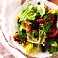 Dinner Salad · Mixed greens, tomatoes, cucumbers, black olives and mozzarella cheese, topped with your choi...