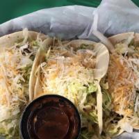 Crunchy Taco Basket (3) · Three corn tortillas filled with shredded beef or shredded chicken then deep fried and toppe...