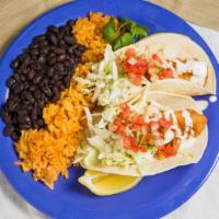 Creek Side Fish Tacos (2) · Grilled or fried cod tacos topped with garlic white sauce, chopped cabbage, pico de gallo, a...