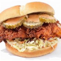 The Cluck Original · Clucks Nashville hot  5oz chicken breast set atop a freshly baked potato bun with pickles an...