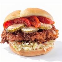 Roasted Tomato Cluck · Deep fried Nashville chicken, Roasted tomato, pickles, home made coleslaw, and a soft butter...