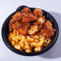 Clucky Cheese · Homemade mac and cheese baked to perfection and topped with 6oz Clucks Nashville hot chicken...