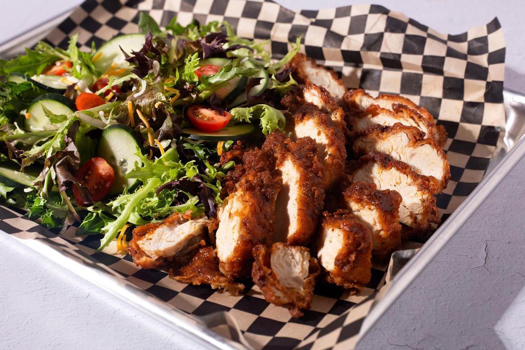 Salad Clucks Original · Sliced 5oz Nashville Hot Chicken breast, roasted corn, cucumbers, pico de gallo, shredded cheddar jack cheese, on a bed of greens. Served with a spicy ranch dressing on the side.