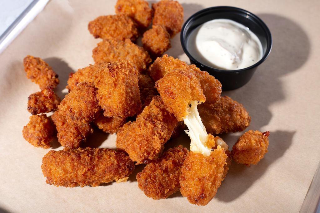 Spicy Cheese Curds · Spicy Breaded Wisconsin Cheese Curds are made with fresh Wisconsin cheese curds and lightly breaded with a spicy flavor kick for authentic cheesy goodness in every bite.