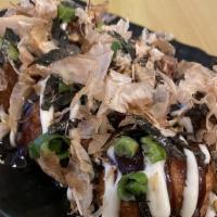 Takoyaki (6) · Octopus ball, takoyaki sauce, mayo, green onion, bonito flakes.