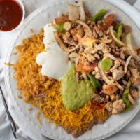 Fajitas Combination · With a side of rice, beans, guacamole and sour cream.