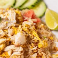 Crab Fried Rice  · Jasmine rice stir-fried with egg, onion, tomato, green onion, and crab meat topped with cila...