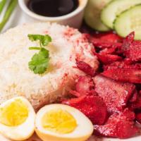 Khao Moo Dang · Thai street food red BBQ pork served with boiled egg and jasmine rice with house black sauce.