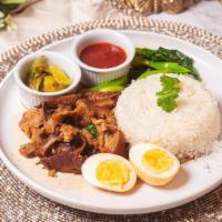 Khao Kaa Moo · Slow-cooked pork leg stew in rich Thai spices aromatic brown sauce served with boiled egg, C...