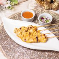 Grilled Chicken Satay (4) · Grilled marinated chicken on skewers served with peanut sauce and cucumber salad.