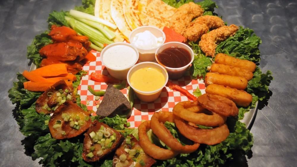 Felt Sampler · Chicken tenders, cheese sticks, half lb. of wings, onion rings, potato skins and cheese quesadilla, served on one enormous platter.