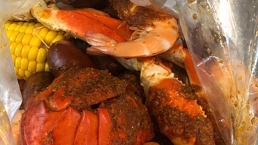 Captain'S Choice Combo · 1 lobster tail, 1/2 snow crab (1 cluster), 1/2 lb head on shrimps, 1 corn or 2 potatoes, 1/2 lb sausage.
(Head Off or Peel/Deveined also available for $2.00 more).